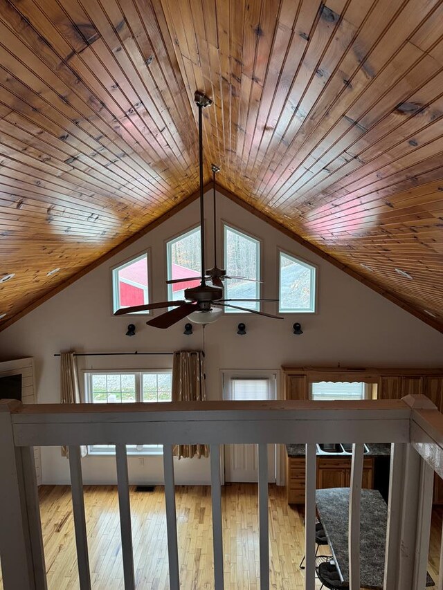 bonus room with high vaulted ceiling, wooden ceiling, and light wood-style floors