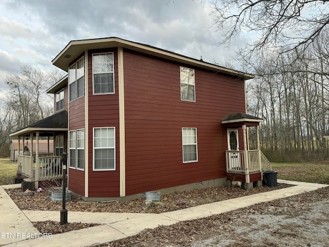 view of side of property with crawl space