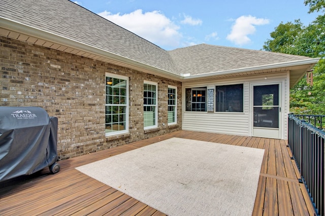 wooden deck with area for grilling