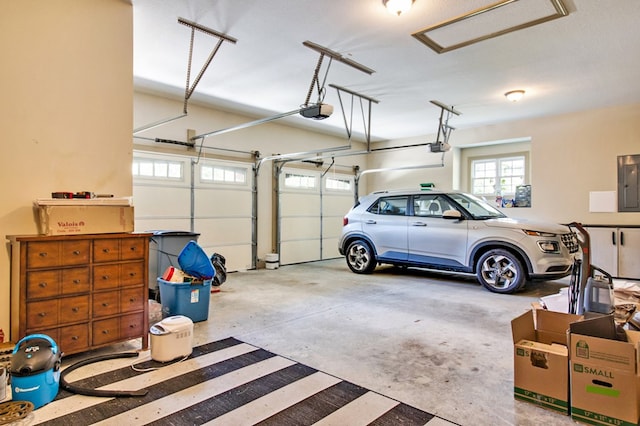 garage featuring a garage door opener and electric panel