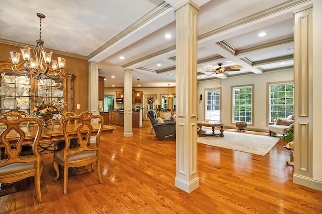 dining room featuring ornate columns, beam ceiling, wood finished floors, and ceiling fan with notable chandelier