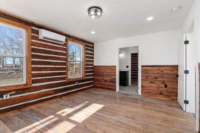 interior space with electric panel and wood finished floors