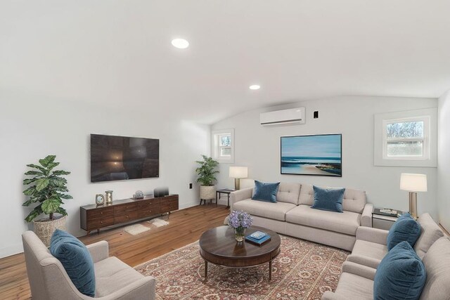 spare room with baseboards, wood finished floors, and recessed lighting