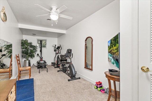 workout area with ceiling fan, carpet, visible vents, and baseboards