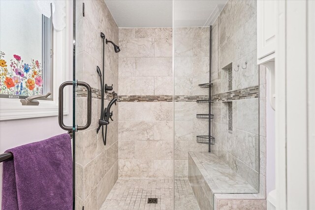 bathroom featuring a tile shower