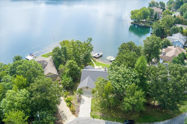 drone / aerial view with a residential view and a water view