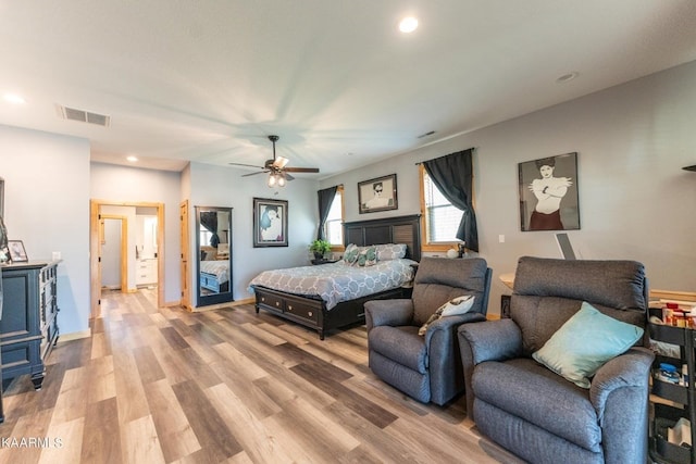 bedroom featuring light wood-type flooring, baseboards, visible vents, and recessed lighting