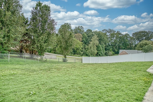 view of yard with fence