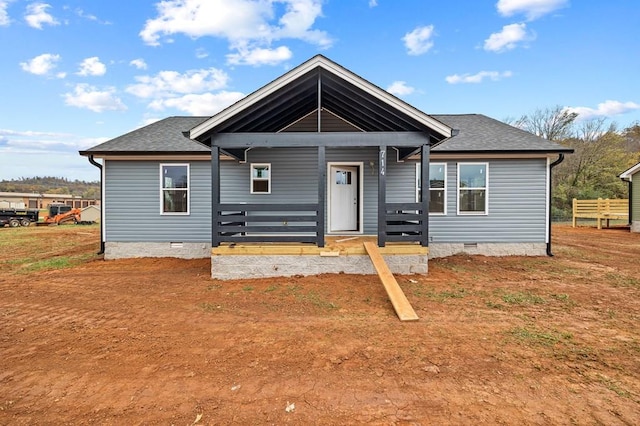 view of front of home with a porch, crawl space, and a shingled roof