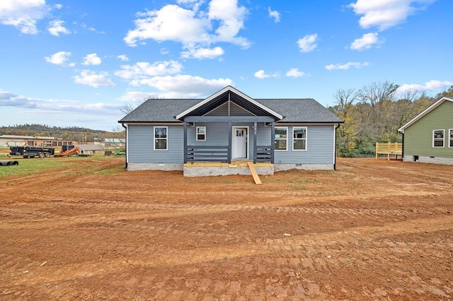 bungalow featuring crawl space and roof with shingles