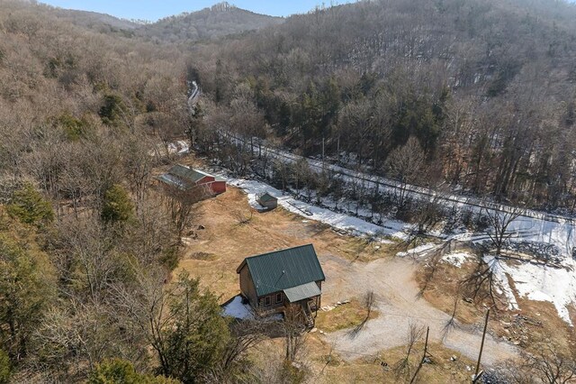 bird's eye view with a mountain view and a wooded view