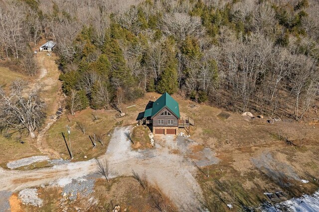 drone / aerial view featuring a forest view