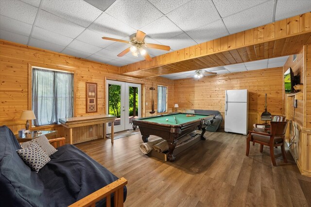 rec room featuring ceiling fan, a paneled ceiling, pool table, wood finished floors, and french doors