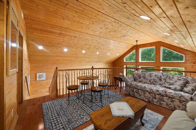 interior space featuring dark wood-style floors, vaulted ceiling, wooden ceiling, and wood walls