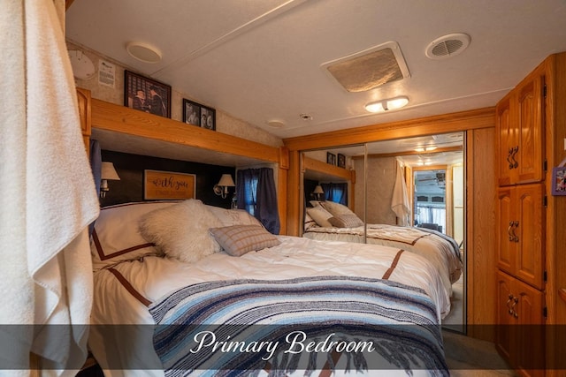 bedroom featuring visible vents and a closet