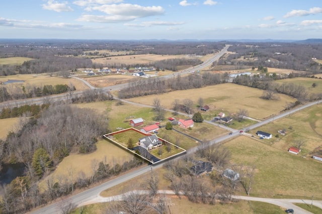 birds eye view of property featuring a rural view