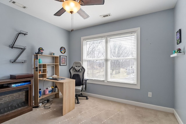 office featuring visible vents, baseboards, and a ceiling fan