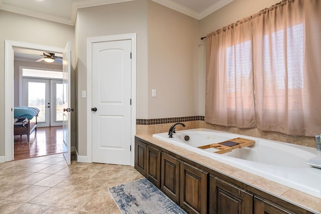 full bathroom featuring ceiling fan, tile patterned flooring, ornamental molding, french doors, and a jetted tub