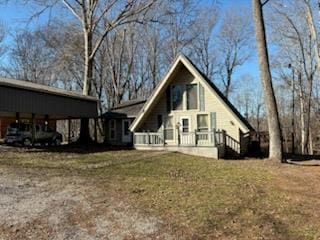 view of home's exterior featuring a carport and a yard