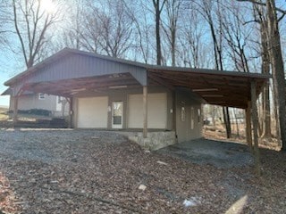 exterior space featuring driveway and a detached garage