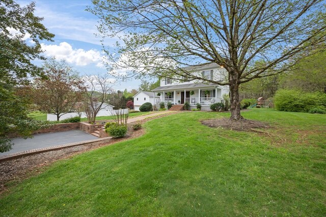 view of front of home featuring a porch and a front lawn