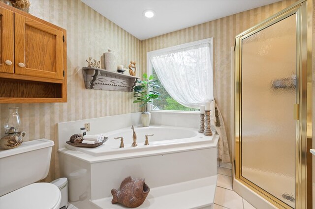 full bathroom with toilet, wallpapered walls, a shower stall, and a garden tub