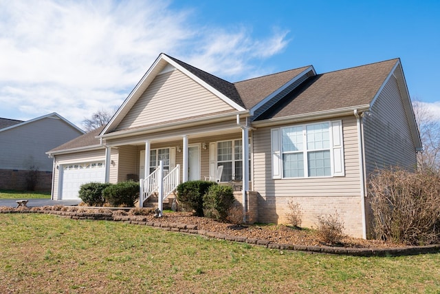 view of front of property with covered porch, a front lawn, a garage, aphalt driveway, and brick siding