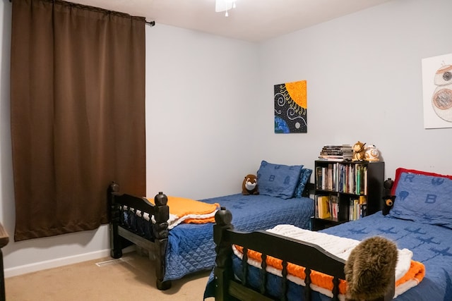 bedroom featuring carpet, baseboards, and ceiling fan