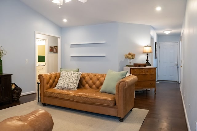 living room featuring recessed lighting, baseboards, lofted ceiling, and wood finished floors