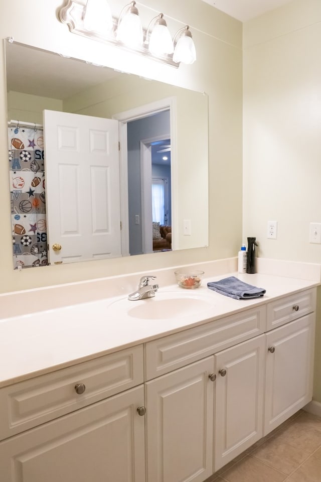 full bath featuring tile patterned floors and vanity