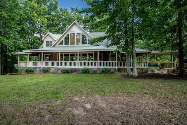 country-style home with metal roof, a porch, and a front lawn