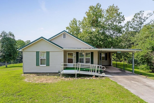 view of front of property featuring covered porch, driveway, an attached carport, and a front yard