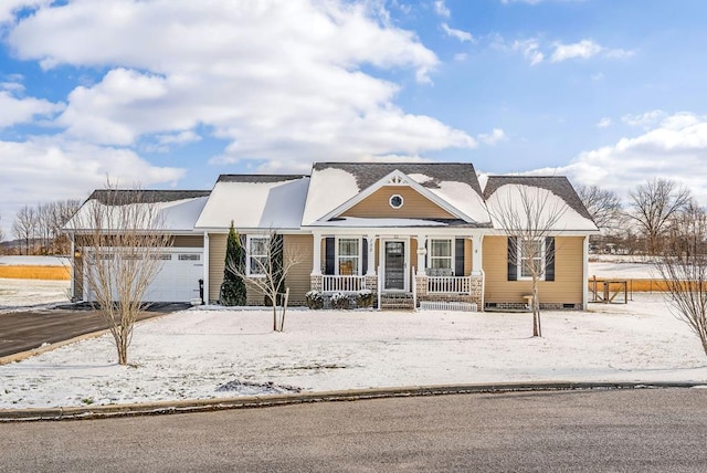 traditional home featuring a garage and covered porch