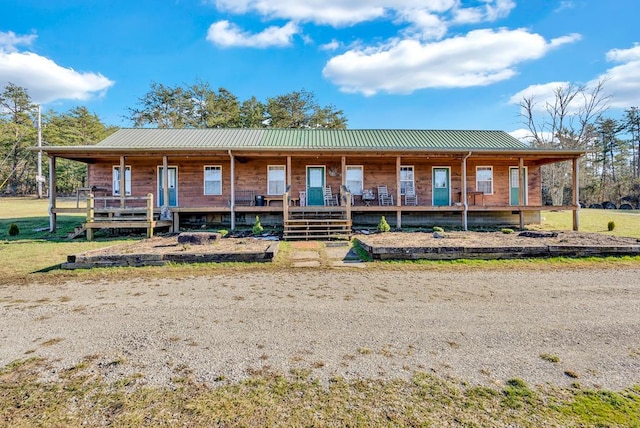 view of front of house with covered porch and metal roof