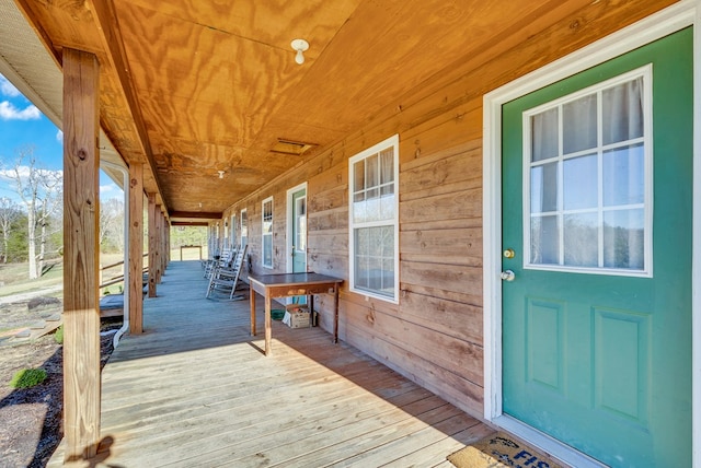 wooden deck featuring covered porch