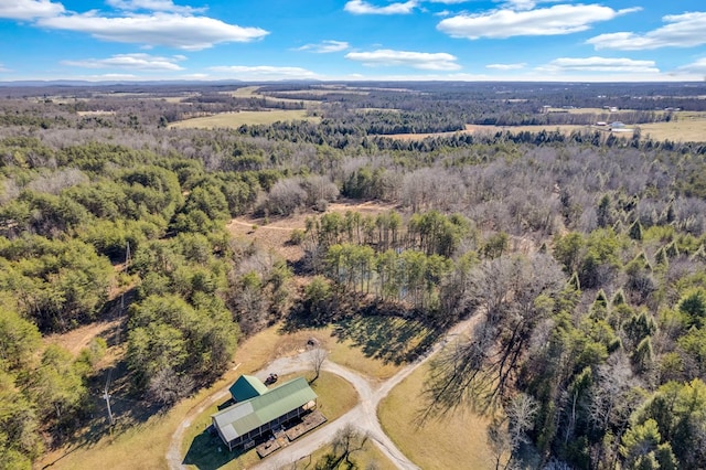 birds eye view of property with a wooded view