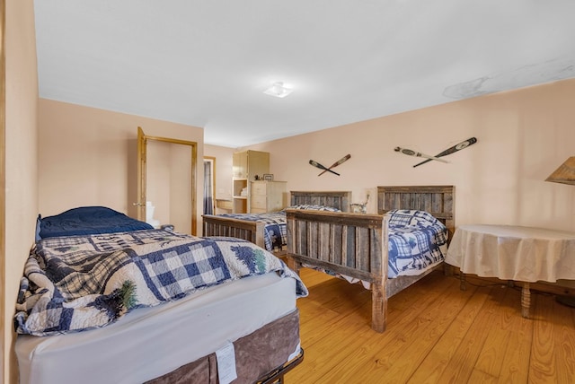 bedroom with light wood-type flooring