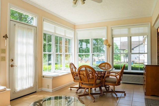 sunroom / solarium with a ceiling fan