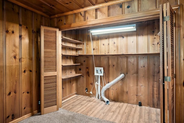 interior space featuring wood walls, wood finished floors, and wood ceiling