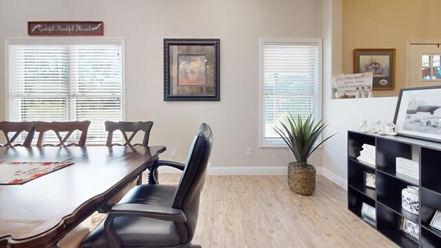 office featuring light wood-type flooring and baseboards