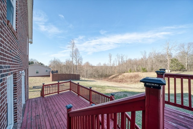 wooden terrace with a lawn