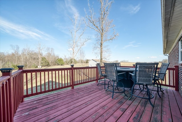 wooden deck with outdoor dining area