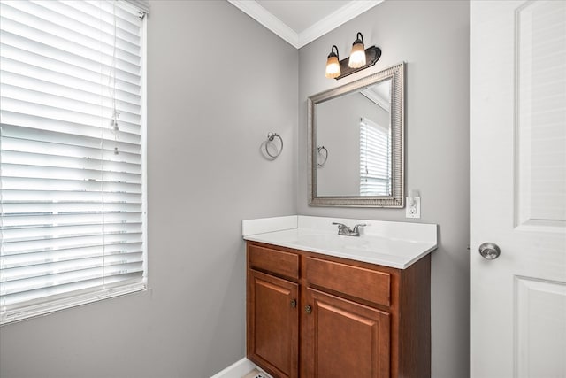 bathroom featuring crown molding and vanity