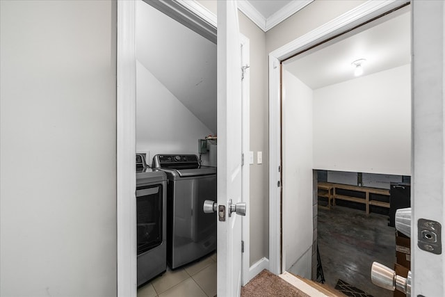 clothes washing area with laundry area, ornamental molding, and washer and dryer