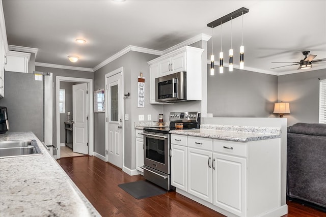 kitchen featuring open floor plan, stainless steel appliances, dark wood finished floors, and crown molding