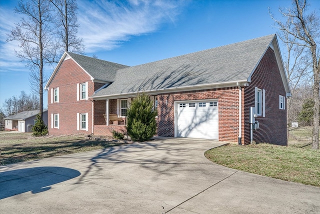 split level home featuring a shingled roof, brick siding, driveway, and an attached garage