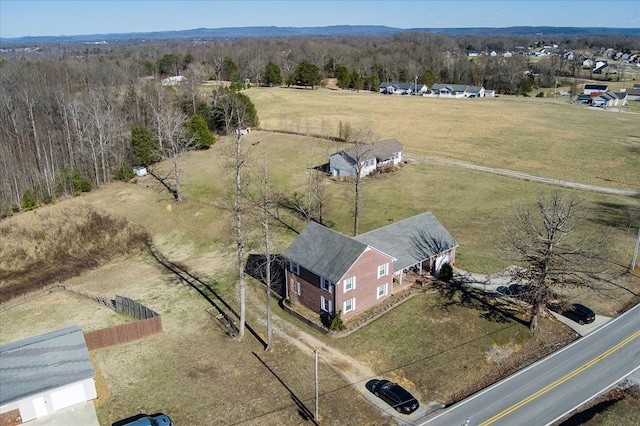 birds eye view of property with a rural view