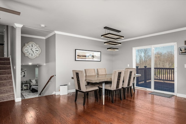 dining area with stairs, crown molding, baseboards, and wood finished floors