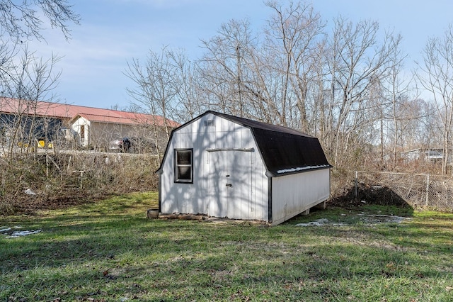 view of shed featuring fence