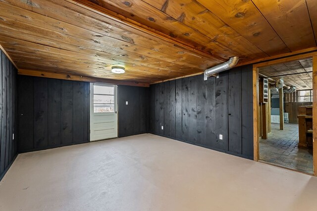 below grade area with wooden ceiling and wood walls